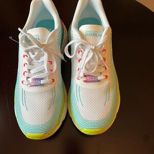 Woman’s Skechers Max Cushion White and Blue Sneakers